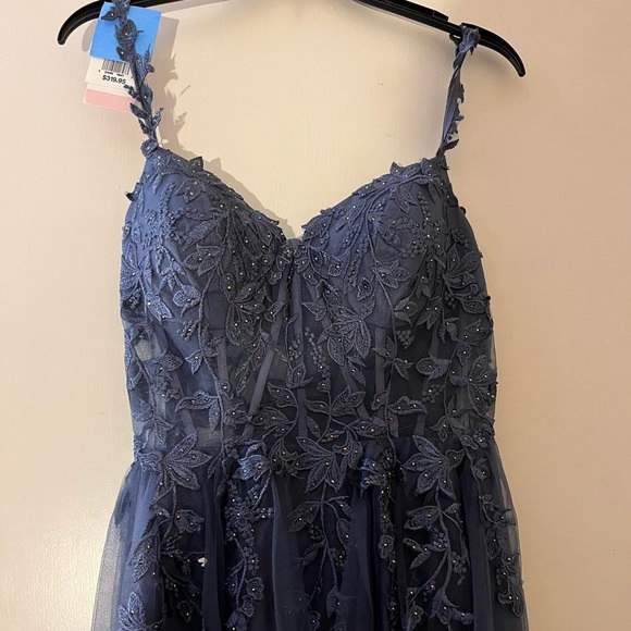 A size 10 prom dress from David’s bridal that is a shade of blue. - Picture 3 of 6